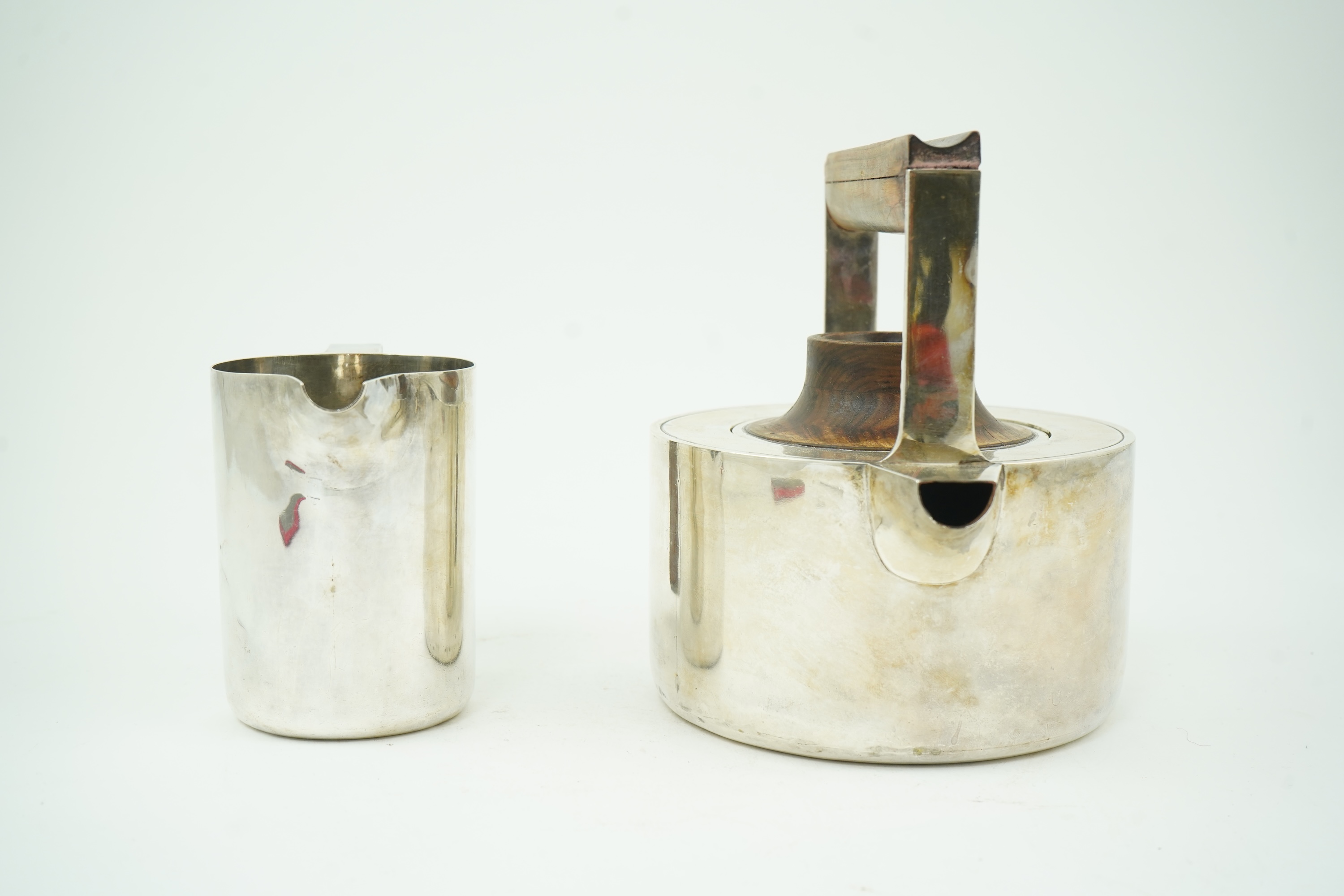 Roy Ridsdale (1942-2020): A silver tea kettle and matching cream jug